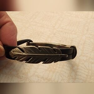 Leather and silver bracelet.